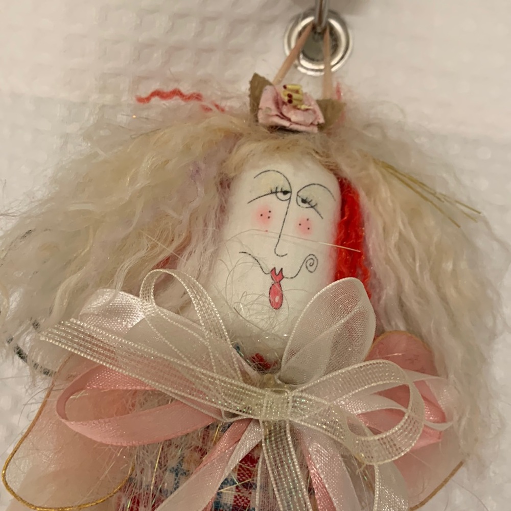 Charming hanging doll